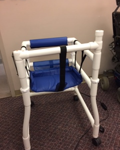 Blue and white PVC stroller/walker for a differently-abled person